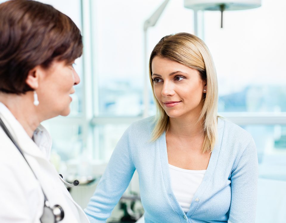 Doctor talking to a potential surrogate about surrogate selecting and matching and physician-directed surrogacy