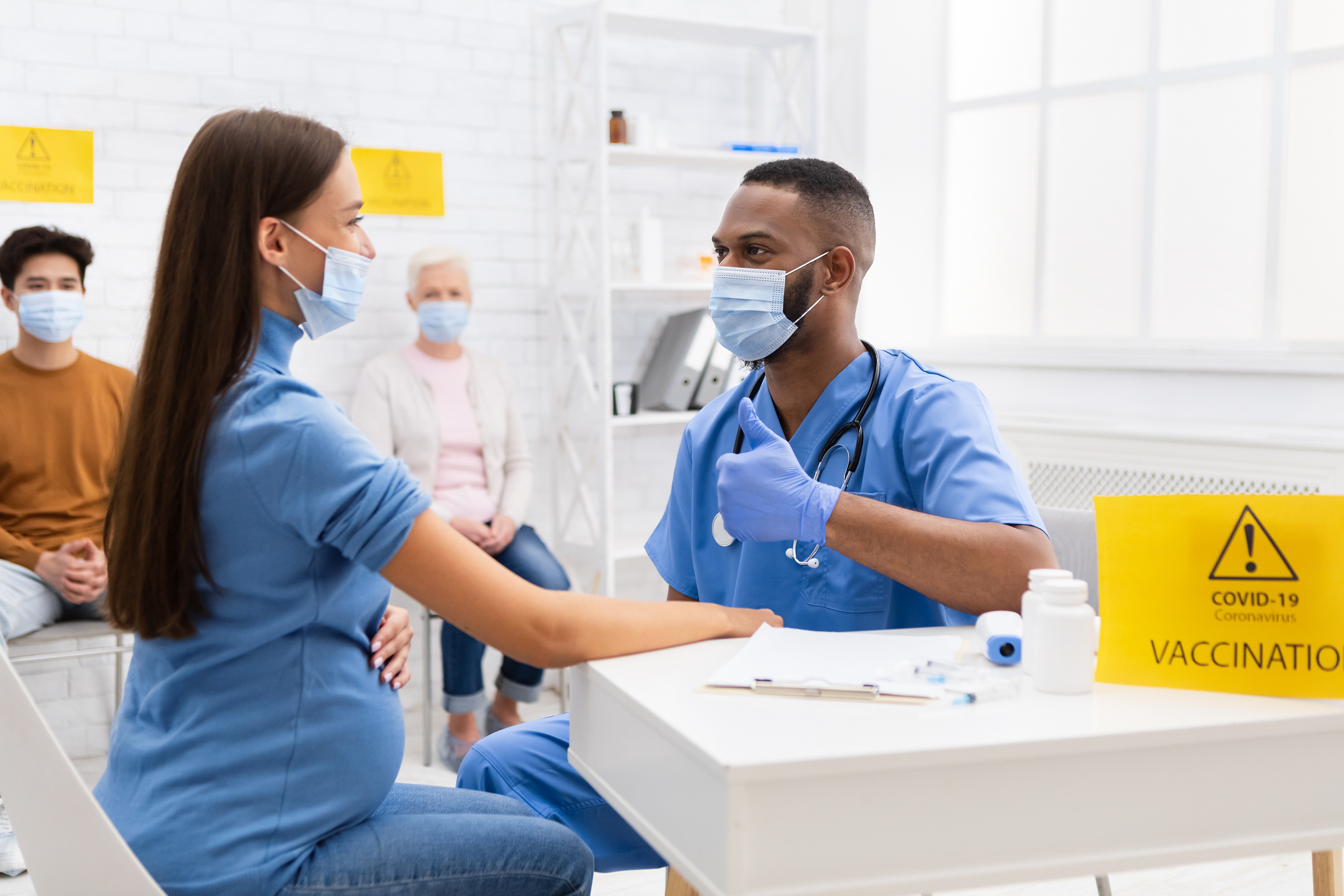Pregnant woman receiving the COVID vaccine