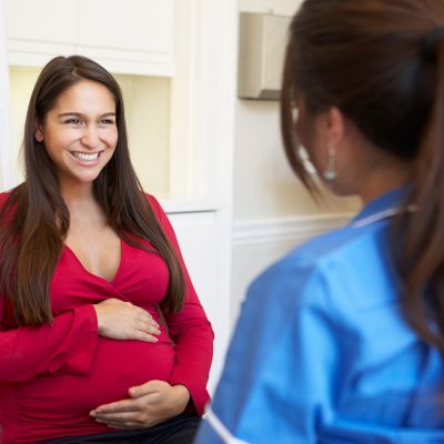 pregnant surrogate with surrogacy nurse