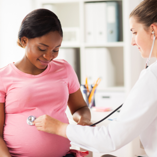 Obstetrician examining pregnant surrogate, surrogate requirements